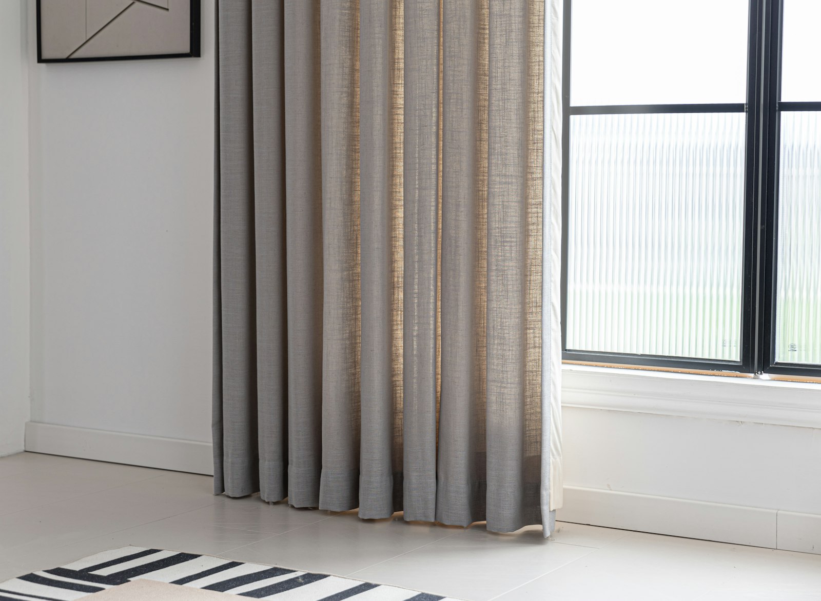 Curtains framing a sunny window