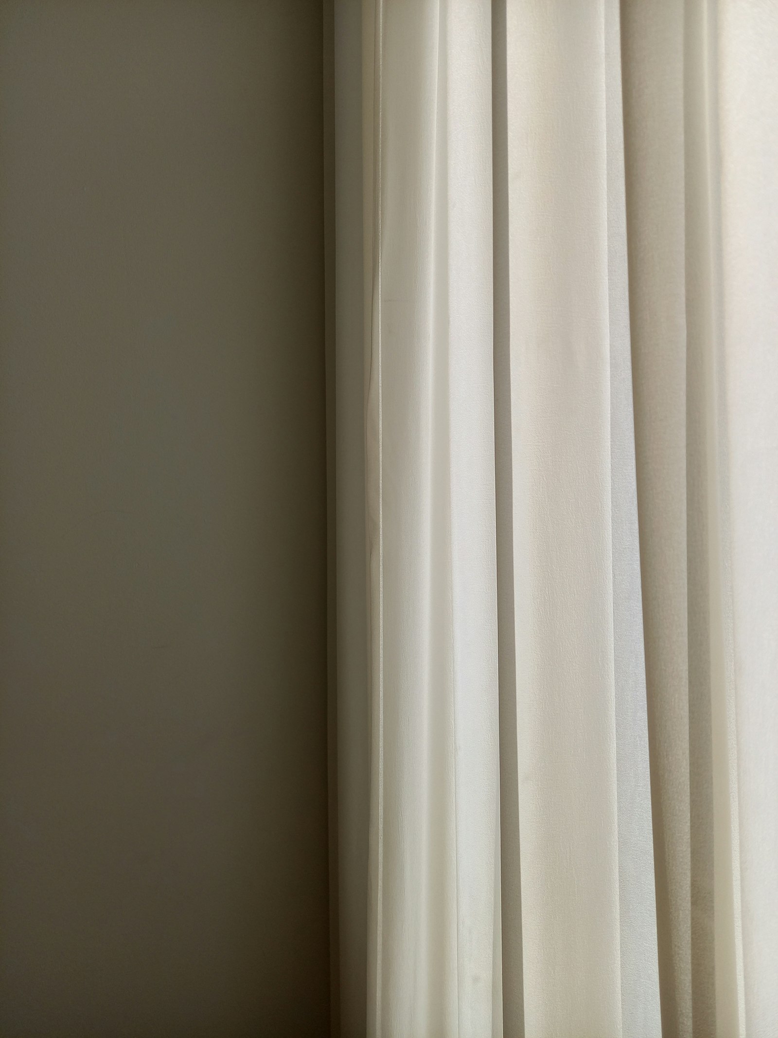 Window with a sheer white curtain